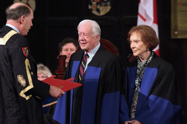 Former President Jimmy Carter and his wife, Rosalynn, receive honorary degrees from Queen's University Chancellor David Dodge