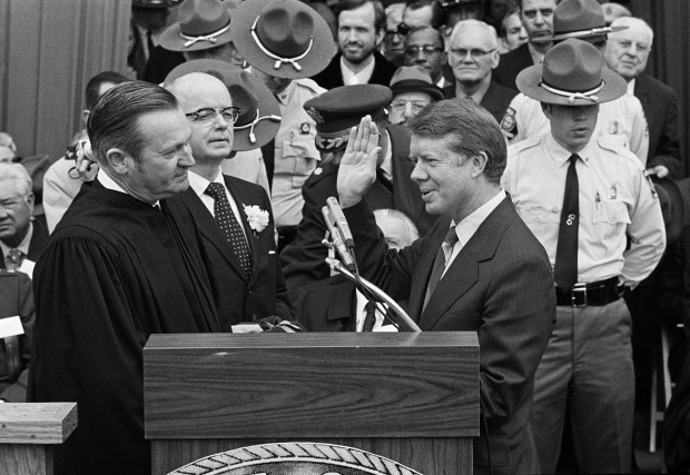 Judge Robert H. Jordan administers the oath of office to Gov. Jimmy Carter at the Georgia Capitol