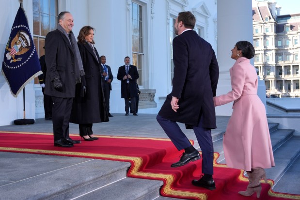 Vice President Kamala Harris, center left, and second gentleman Doug Emhoff, left, greet Vice President-elect JD Vance, center right, and his wife Usha Vance, right, upon arriving at the White House, Monday, Jan. 20, 2025, in Washington. (AP Photo/Evan Vucci)
