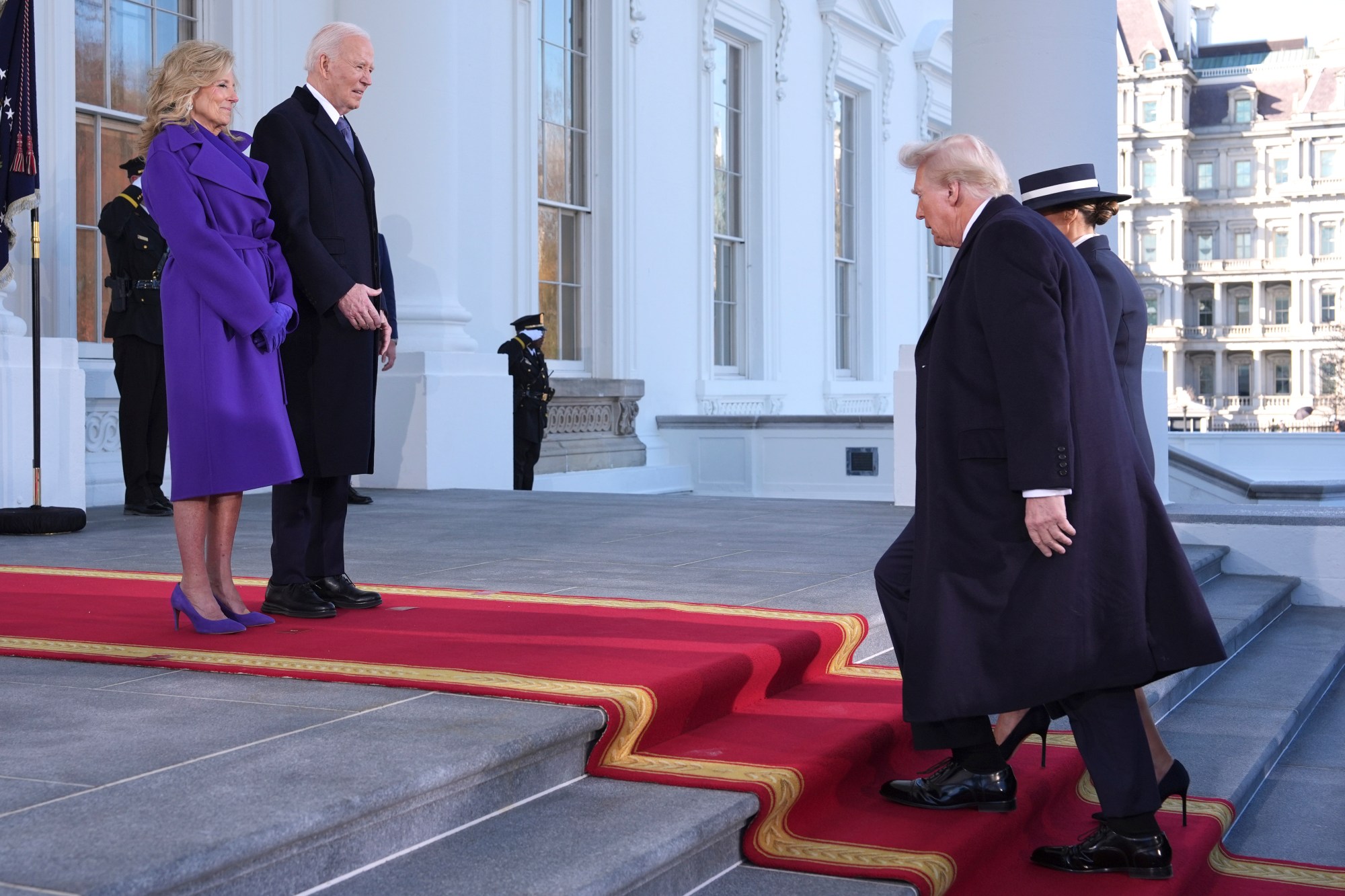 President Joe Biden, center left, and first lady Jill Biden, left, greet President-elect Donald Trump, center right, and Melania Trump, right, upon arriving at the White House, Monday, Jan. 20, 2025, in Washington. (AP Photo/Evan Vucci)
