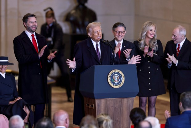 President Donald Trump speaks from Emancipation Hall as Vice President JD Vance, from left, House Speaker Mike Johnson, his wife Kelly Johnson and House Majority Leader Steve Scalise, R-La., listen after the 60th Presidential Inauguration, Monday, Jan. 20, 2025, at the U.S. Capitol in Washington. in Emancipation Hall at the 60th Presidential Inauguration, Monday, Jan. 20, 2025, at the U.S. Capitol in Washington. (Graeme Jennings/Pool Photo via AP)