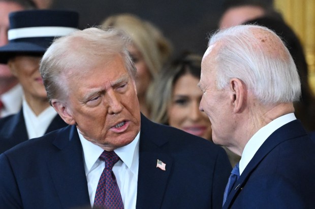 US President Joe Biden looks on as US President-elect Donald Trump arrives during the inauguration ceremony before Trump is sworn in as the 47th US President in the US Capitol Rotunda in Washington, DC, on January 20, 2025. (Photo by SAUL LOEB / POOL / AFP) (Photo by SAUL LOEB/POOL/AFP via Getty Images)