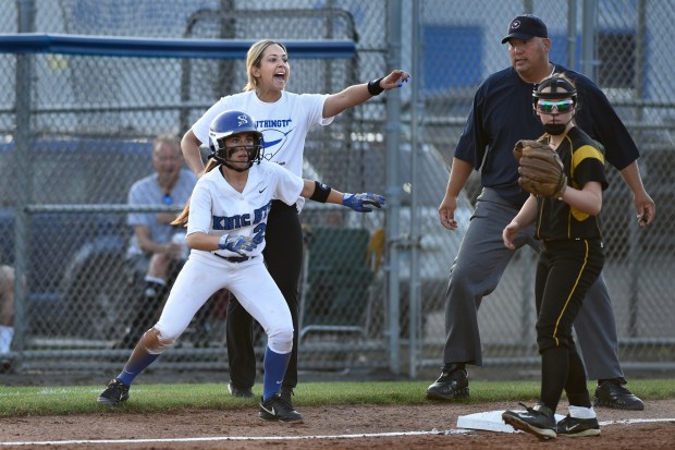 Southington softball head coach Davina Hernandez yells to a player while coaching third base and team member Michelle Woodruff (2) in a Class LL semi final game against Amity at Frank Biondi Field in West Haven. Southington, the defending Class LL champions, lost to Amity 4-1.