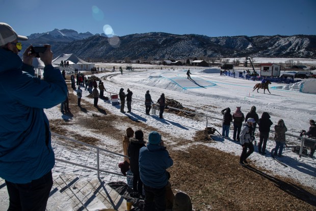 Spectators watch the first day of the 9th annual San Juan Ski Joring competition held Friday, Jan. 10, 2025, at the Ouray County Fairgrounds in Ridgway. (Photo by William Woody/Special to The Denver Post)