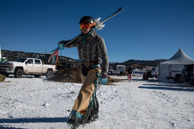 San Juan Ski Joring competitor Lacey Anderson walks to the starting line during the novice competition of the San Juan Ski Joring event held Friday, Jan. 10, 2025, at the Ouray County Fairgrounds in Ridgway. (Photo by William Woody/Special to The Denver Post)