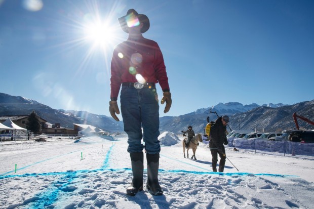 Ridgeway Resident and San Juan Ski Joring organizer Richard Weber III walks the course to make sure skiing conditions are right before the start of the San Juan Ski Joring event held Friday, Jan. 10, 2025, at the Ouray County Fairgrounds in Ridgway. (Photo by William Woody/Special to The Denver Post)