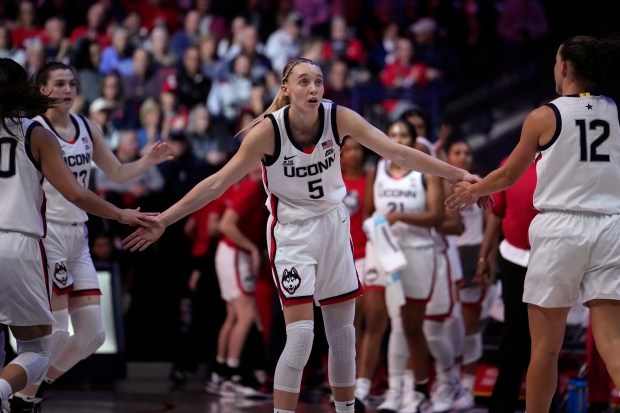Paige Bueckers #5 of the Connecticut Huskies cheers on teammates against the Fairleigh Dickinson Knights during the first half of an NCAA women's basketball game at the Harry A. Gampel Pavilion on Nov. 20, 2024 in Storrs, Connecticut. (Photo by Joe Buglewicz/Getty Images)