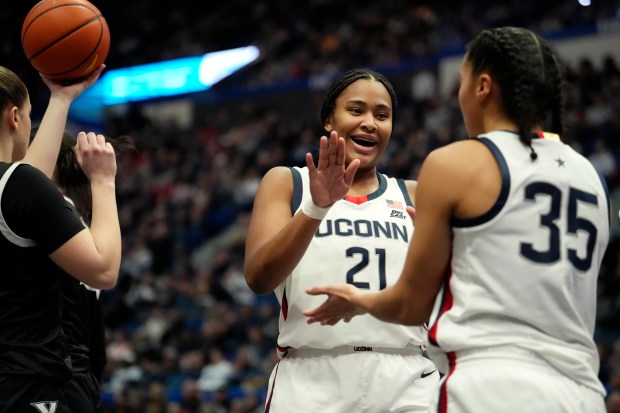 Sarah Strong #21 and Azzi Fudd #35 of the Connecticut Huskies react during the first half of an NCAA women's basketball game against the Xavier Musketeers at the XL Center on Jan. 8, 2025 in Hartford, Connecticut. (Photo by Joe Buglewicz/Getty Images)