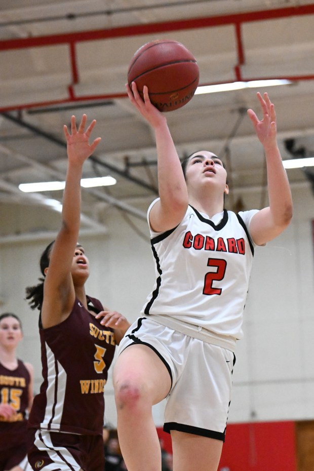 Conard's Emily Knowles (2) shoots against South Windsor in their game at Conard High School, West Hartford, Jan. 22, 2024. Conard won, 42-18. Photo by Cloe Poisson/Special to the Courant