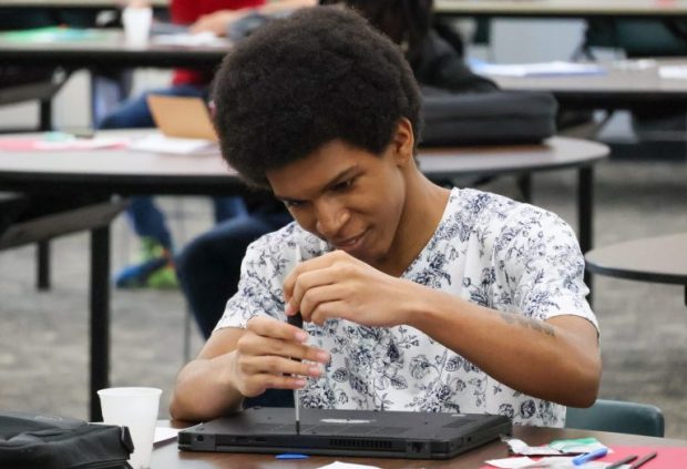 A Bulkeley High School student assembles a computer from scratch during a week-long summer program, with the bonus of getting to keep the finished product.