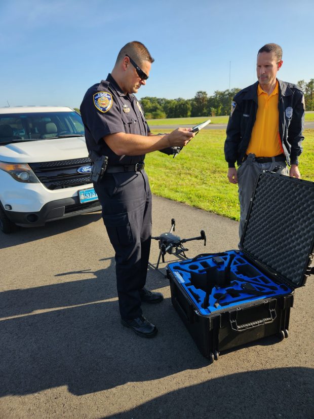Plainville Police Department Lt. John Rene Quilter, left, working on a drone project along with Det. Matt D'Amore last year. (Courtesy of the Town of Plainville)
