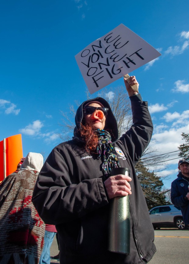 Heather Merrick, a machinist at Pratt and Whitney in Middletown, wears a pig nose as she gathers with members of the Machinists Union to rally in front of Pratt and Whitney in Middletown after machinists were locked out on Friday, Jan. 3, 2025. (Aaron Flaum/ Hartford Courant)