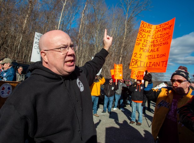 Wayne McCarty, President of Machinists Union C.A.N.E.L. Lodge 700, directs Pratt and Whitney Machinists to march with signs during an union rally in front of Pratt and Whitney in Middletown after machinists were locked out on Friday, Jan. 3, 2025. (Aaron Flaum/ Hartford Courant)