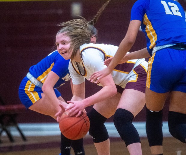 Sheehan's Megan Wresien (33) looks to make a pass as she is covered by Mercy's defense during the first half at Sheehan High School on Thursday, Feb. 9, 2025. (Aaron Flaum/Hartford Courant)