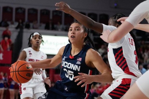 UConn's Azzi Fudd (35) drives past St. John's A'riel Little (3) during the second half of an NCAA women's college basketball game, Wednesday, Jan. 15, 2025, in New York. (AP Photo/Frank Franklin II)